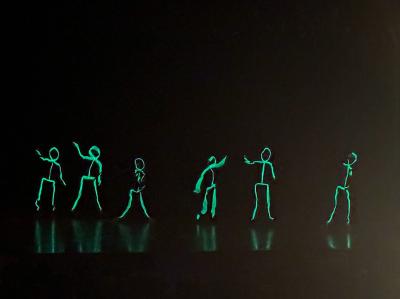The first number featured glowing, dancing stick figures.