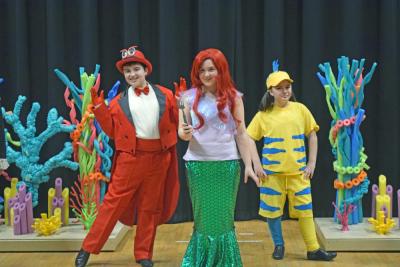 Sebastian (Nicolas Faria,) Ariel (Layla Ruiz,) and Flounder (Julia Thomas.)