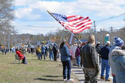 The American flag waves in front of the crowd. Photos by Kat Sheridan