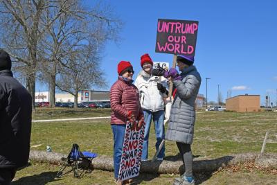 A group has a conversation while protesting.