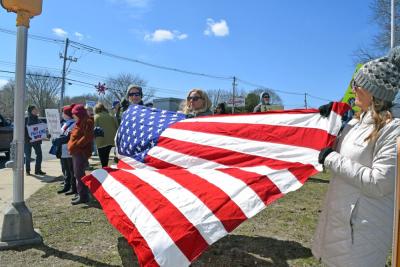 A number of protesters brought a large American flag.