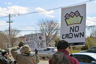 One sign questioned how free this country is.