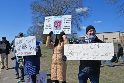 Some of the protesters standing and protesting together.