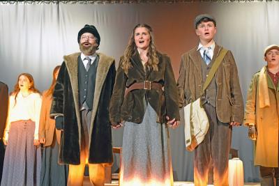 Vlad (Nolan Woodard,) Anya (Emerson Palumbo) and Dimirtry (Jack Nylin) sing before getting on the train. Photos by Kat Sheridan