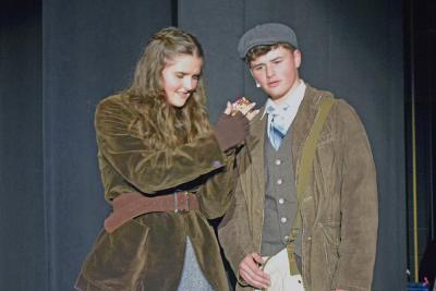 Anya (Emerson Palumbo) and Dimirtry (Jack Nylin) look at a music box. 