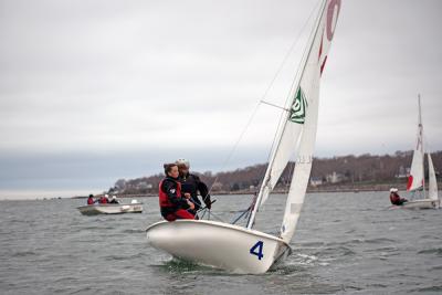 Maisy Sperry, an alumnus, returned to help with practice, sails with Phoebe Murray. 