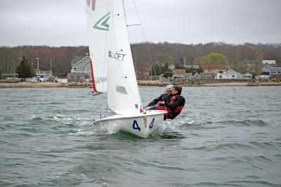 Maisy Sperry and Phoebe Murray lean to steady the boat.