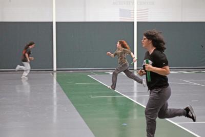 Alexis Benjamin races Nathalia Hanley with Etta Hall in the background