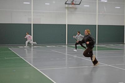 Seniors Kaelyn Zuber, Chace Levasseur, and Emma Garcia lead their teams in the relay race. 