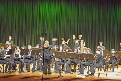 The band encourages the crowd to clap along. 