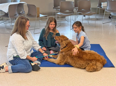 Layla Kruz, age 9 and Vivian Amaral, age 9 pet Enzo. 