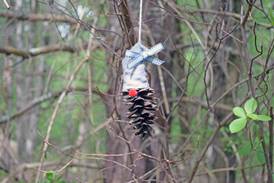 A gnome with a bow on their head. 