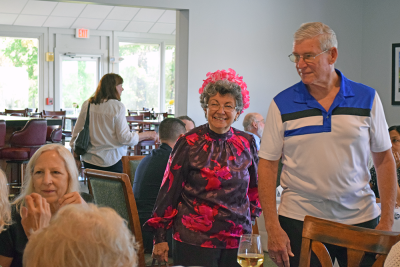Linda and John Oggenfuss enter the luncheon. 
