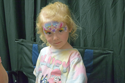 Isabelle, 3, shows off her unicorn face paint. 