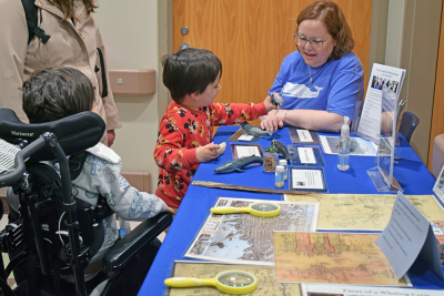 Joseph, 4, and Thomas, 5, learn about the New Bedford Whaling Museum. . 