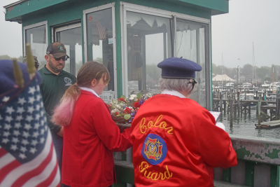 Members of the Color Guard prepare to toss the wreath. 