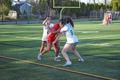 Laila Costa and Tenley Simmons block an opposing player. 
