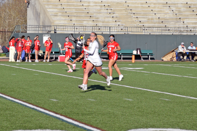 Lily Gangi heads toward the goal with the ball. 