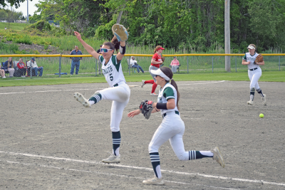 Two players celebrate the end of an inning. Photos by Kat Sheridan