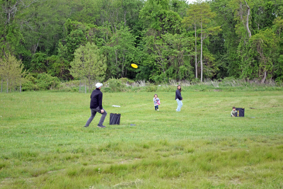 The Kenney family enjoying the lawn games. 