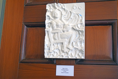 A piece featuring a woman. 