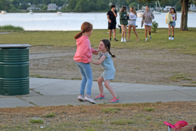 Eliette, 7, and Varou, 5, dance to the music. 
