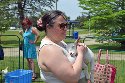 Rachel holding a baby goat.