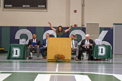 Rachel Lassey cheers for the graduates. 