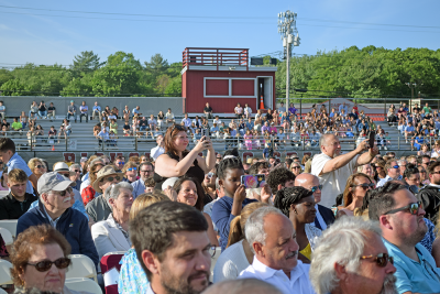 Families capture the moment their family members graduate. 