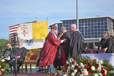 A student receives his diploma. 
