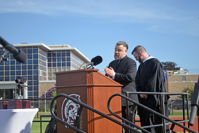 Chaplain Lauren Valliere leads the opening prayer. 