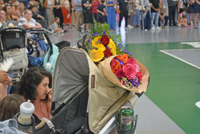 The gym was filled with flowers for the graduates. 