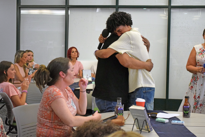 Noah hugs his father thanks. 