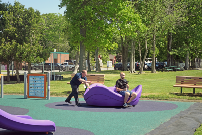 Members of the Dartmouth Community media enjoy the play set. 