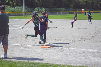 A player runs to first base. 