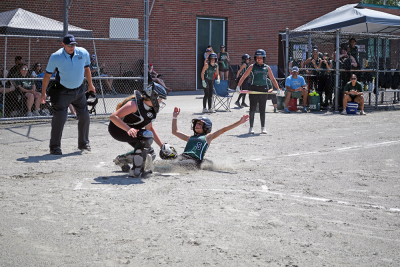 A cloud of dust as a player scores a run. 