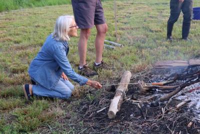 Joney Smith, who is also on the board for the DNRT, enjoys the fire. 