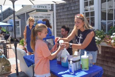 Taegan Carter, 12, gets a free snowcone. 