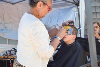 Noah, 5, gets his face painted. 