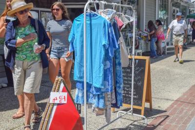 Shirts as a part of a sidewalk sale. 