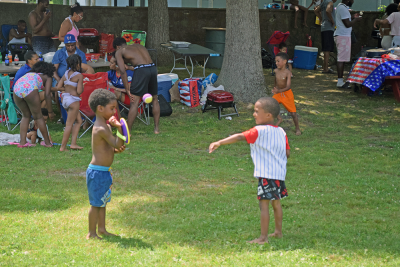 Two kids play during the BBQ. 