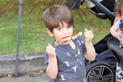 Rafael Pinto, age 3, enjoys a snack. 