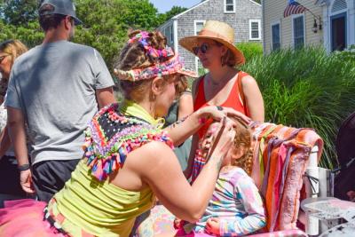 Celia Waldman, 3, gets her face painted. 