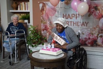 Nellie Jackson blows out the candles on her cake. Photos by Kat Sheridan