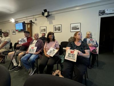 Residents with their signs. Photo by Kat Sheridan