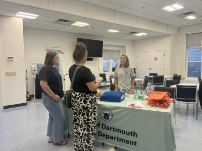 Guests go to the Naloxone training table. 