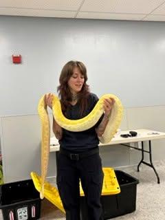 Devon Cloutier holds the snake. Source: Humane Society and Shelter Southcoast Facebook