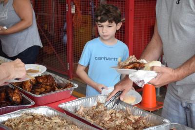Adam, 8, debates if he wants some chicken. 
