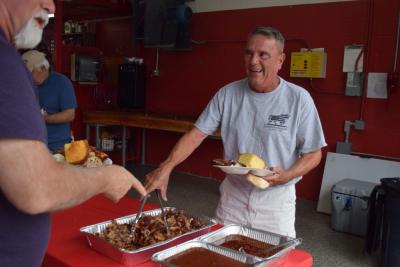 A man enjoys the buffet-style lunch. 