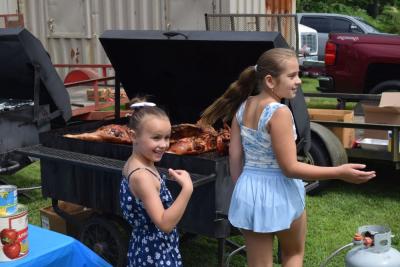 Charlotte O'Connor and Georgia Seland try and get their friend to come look at the whole pig. 